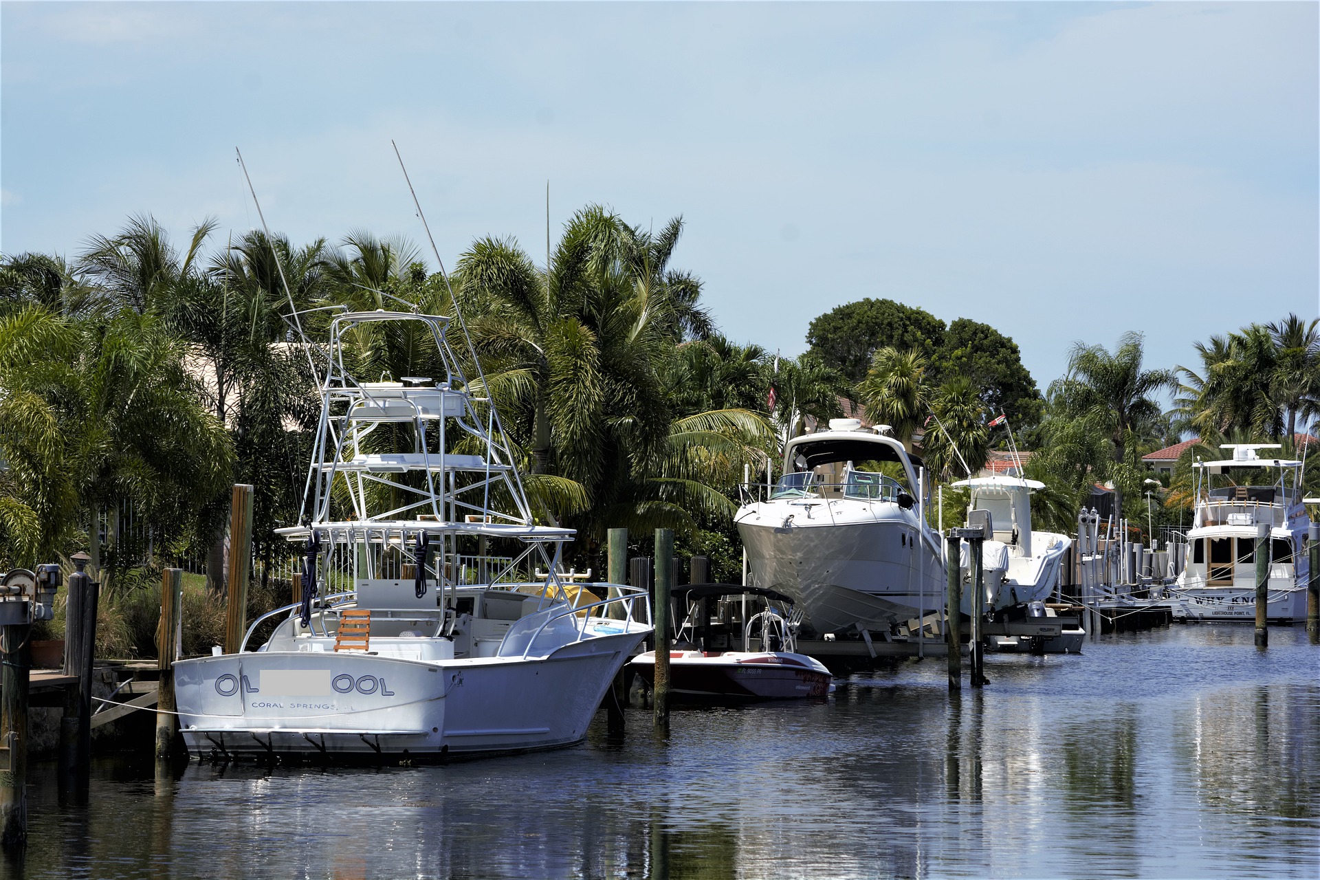 A line of yachts docked on the river side